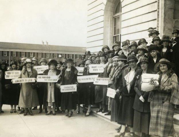 Suffragettes with signs